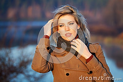 Fashion woman against autumn nature landscape