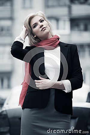 Blond woman walking on the city street