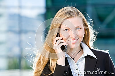 Blonde business woman on mobile phone