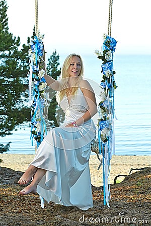 Blonde Girl on a Swing