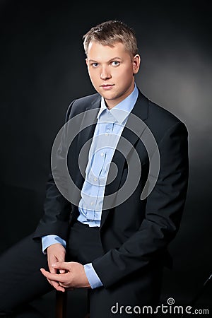 Blonde man wearing formal suit