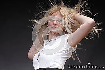 Blonde woman with her hair blowing