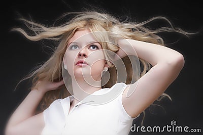 Blonde woman with her hair blowing