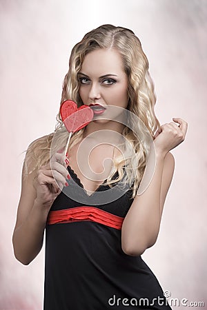 Blonde woman with lollipop