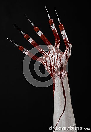 Bloody hand with syringe on the fingers, toes syringes, hand syringes, horrible bloody hand, halloween theme, zombie doctor, black