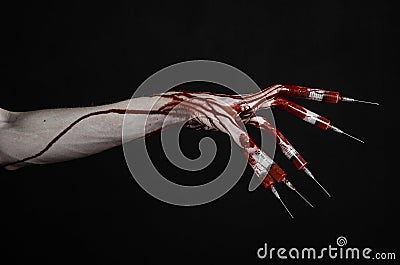 Bloody hand with syringe on the fingers, toes syringes, hand syringes, horrible bloody hand, halloween theme, zombie doctor, black