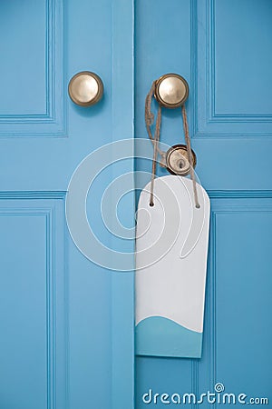 Blue door with hanging sign