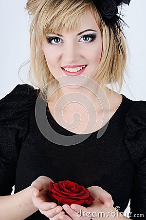 Blue eyed woman with rose