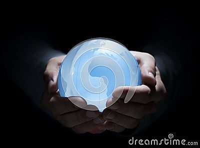 Blue globe in human hands