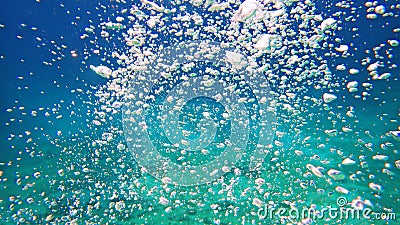 Blue green sea with bubbles