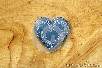 Blue heart on old wood background