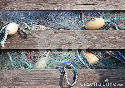 Blue industry fishing nets in old wooden storage box