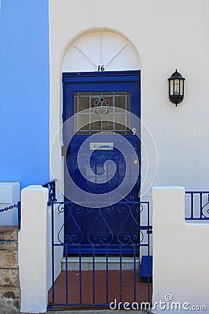 Blue painted metal door, british house entrance