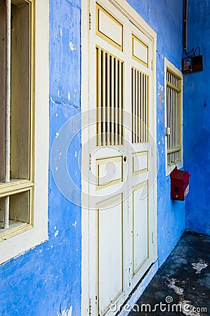 Blue painted shophouse facade