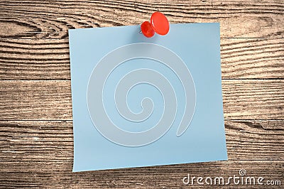 Blue paper note on wood, clipping path.
