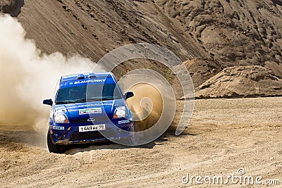 Blue race car Ford Focus at rally