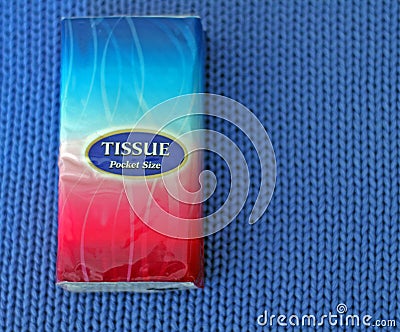 Blue and red tissue pack on blue