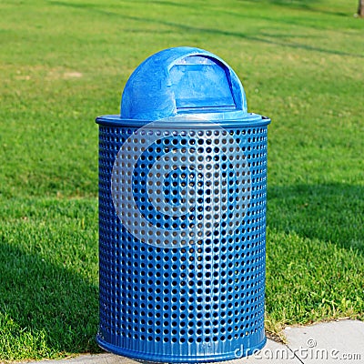 Blue rubbish bin in park