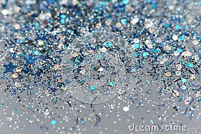 Blue and Silver Frozen Snow Winter Sparkling Stars Glitter background. Holiday, Christmas, New Year abstract texture