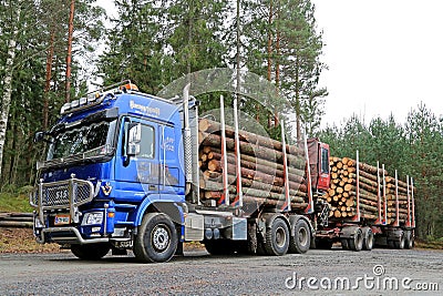 Blue Sisu Polar Timber Truck Hauls Timber