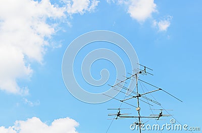 Blue sky with old tv antenna