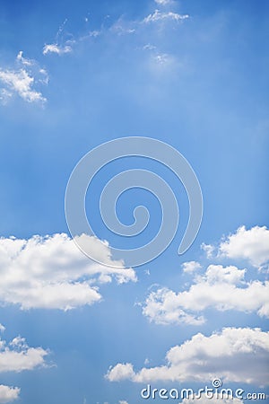 Blue sky with white fluffy clouds background