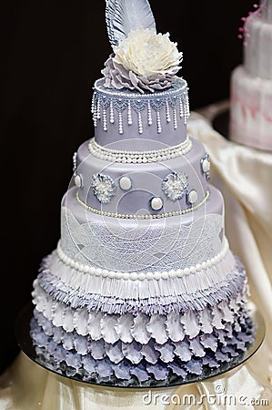 Blue wedding cake decorated with flowers