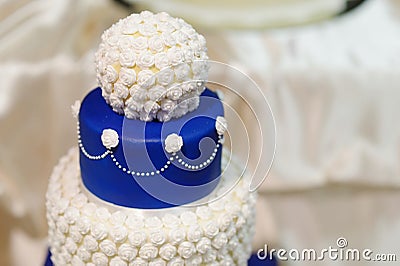 Blue wedding cake decorated with flowers