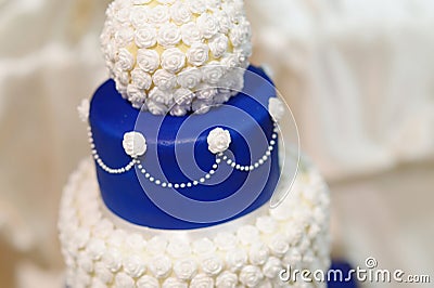 Blue wedding cake decorated with flowers