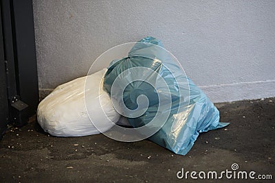 Blue white bin bag laying bottom