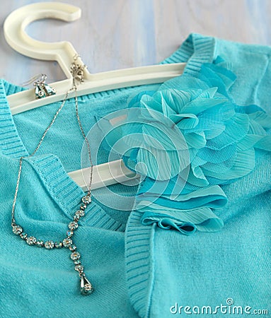 Blue woman s knitted blouse with decoration flower