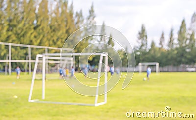 Blur shot of soccer field at school on day time image.