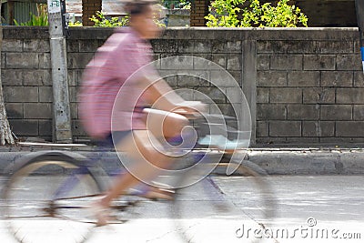 Blurred image of vehicles running on street in Thailand (motion