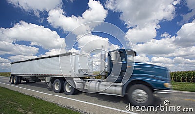 Blurred semi-truck under crazy clouds