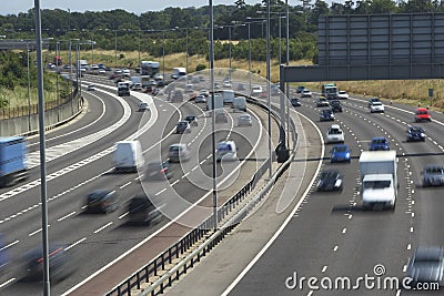 Blurred Traffic On A Busy Highway