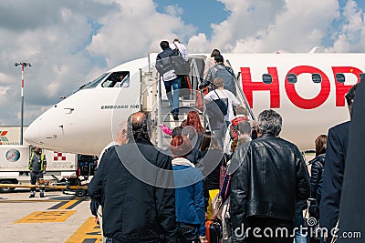 Boarding Air France Hop Jet airplane at Bologna airport