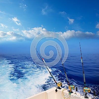 Boat fishing trolling in deep blue ocean offshore