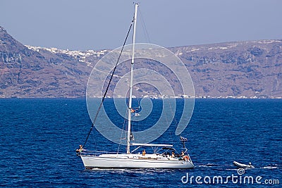 Boat without the sail on background islands Thira (Fira, Santori