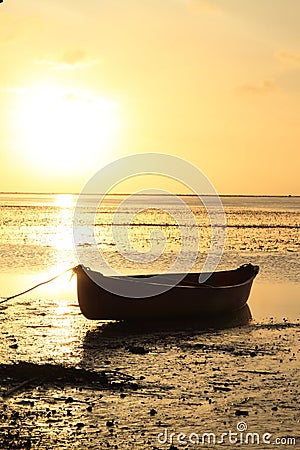 Boat on sunset sea