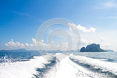 Boat wake prop wash on blue ocean sea