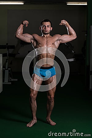 Bodybuilder Performing Front Double Biceps Poses