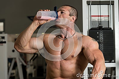Bodybuilder With Protein Shaker