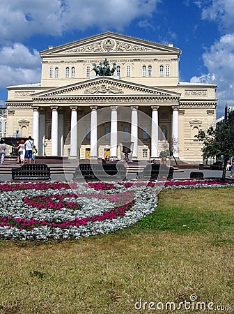 Bolshoi theater in Moscow. Blue sky with clouds.