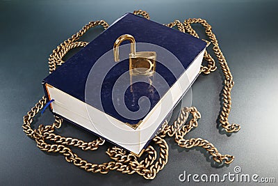 Book with golden chain and lock