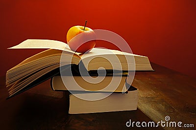 Books and a apple