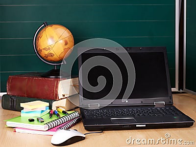 Books and laptop. School supplies.