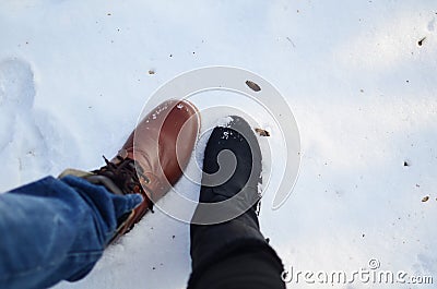 Boot couple on snow together cold