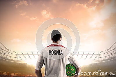 Bosnia football player holding ball
