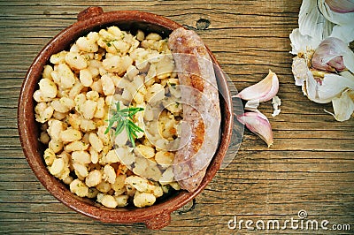 Botifarra amb mongetes, fried white beans and sausage typical of