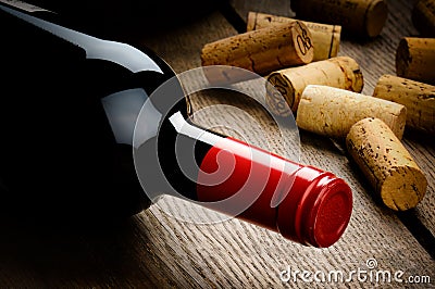 Bottle of red wine and corks